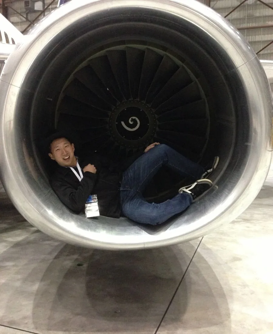 Ed sitting inside a jet engine cowling